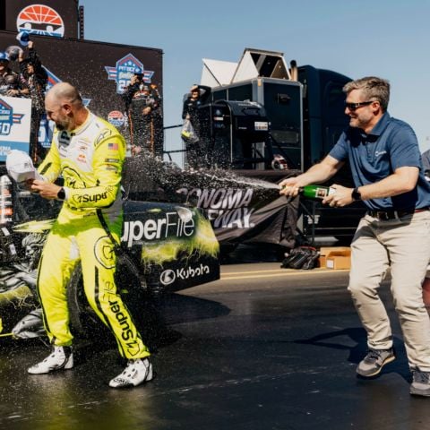 JR Motorsports owner Dale Earnhardt Jr. sprays champagne at Shane van Gisbergen, driver of the No. 9 JR Motorsports Chevrolet, as he celebrates in victory lane after winning Saturday’s Pit Boss/FoodMaxx 250 NASCAR O’Reilly Auto Parts Series race at Sonoma Raceway. 